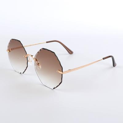 China 2021 Fashion Sunglasses JOSEEN Brand New Design Round Finish Brown Lens Unique Frameless Women Sunglasses for sale