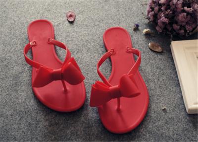 China Plastic Upper Fashion Flip Flops With Bowknot Flat Heel Ladies Thong Slippers for sale