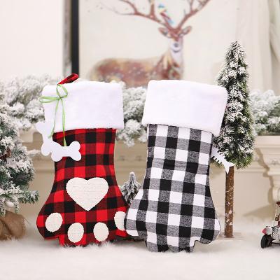 China Short Plush; Coating of the non-woven fabric; Wholesale Custom Felt Fabric Dog Paw Socks Plaid Christmas Stocking Candy Bag for sale