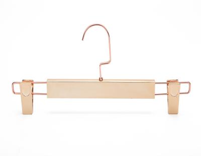 China SHOW Recycled Gold Plastic Pants Hanger With Clips for sale