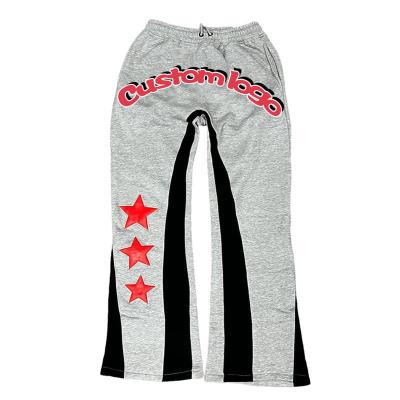 China anti-wrinkle custom logo flared sweatpants cotton nylon rocket track pants men jogger sport sweatpants mens flare pants for sale