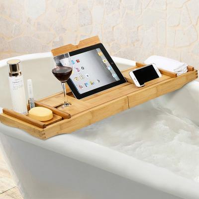 China Sustainable Design Wooden Bathtub Caddy Luxury Bamboo Bath Tub Tray With Expanding Sides Shower Organizer for sale