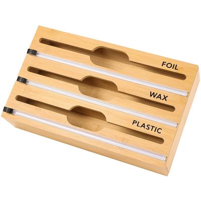 China Sustainable Bamboo Wood Plastic Wrap 3 Foil In 1 Foil Plastic Dispenser With Stainless Steel Cutter Storage Box for sale