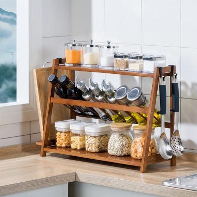 China Sustainable Bamboo Kitchen Glass Adjustable Spice Rack Set Jar Rack Bottles Spice Storage Container Seasoning Bottles With Drawer Tray for sale