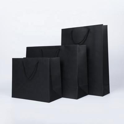 China Recycled Materials Hot Popular Custom Luxury Black Clothes Store Retail Packaging Gift Carry Bags Boutique Shopping Paper Bags With Your Own Logo for sale