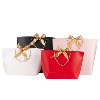 China Recycled Materials Custom Printed Logo Small Boat Shape Boutique Bag Colorful Thank You Gift Paper Bags With Ribbon Bowknot for sale