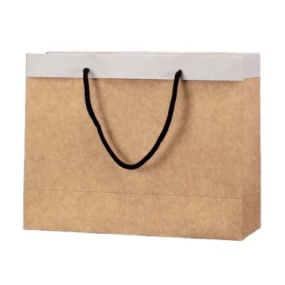 China Custom Luxury Brown Paper Bags Eco Friendly Recycled Materials Kraft Paper Gift Shopping Bags With Your Own Logo for sale