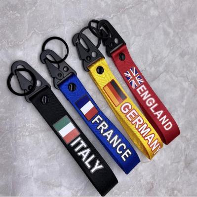 China Souvenir Gift New Arrival Metal Motorcycle Flag Germany France Italy Embroidery Key Chain for sale