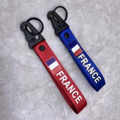 China Souvenir Gift Ourist Souvenir Country France UK Germany Flag Embroidery Key Chain for sale