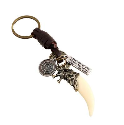 China Bottle Opener Keychain Vintage Antique Tiger Tooth Alloy Bronze Leather Key Chain For Car Bag for sale