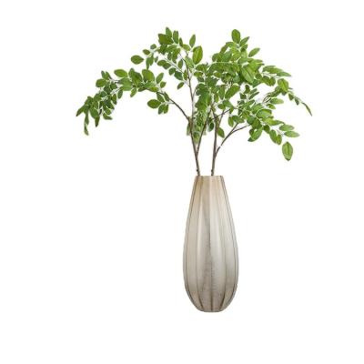 China Minimalist home decoration artificial tree simulation green planting ornaments fake single branch tree Nan tian leaves for sale