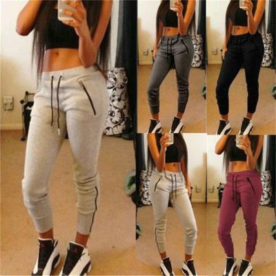 China Anti-Wrinkle Autumn Women Casual Pants Stretch Clothing Sports Tracksuit With Ruched Sides Solid Stacked Pants Legging for sale