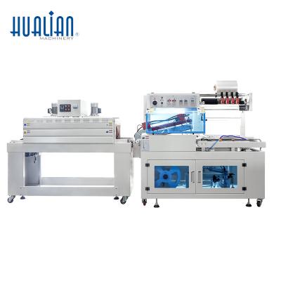 China Food BSF-5640LG/E+BS-4522 Hualian Automatic Heat Cutting And Shrink Wrap Wrapping Film Tunnel Packing Machine For Boxes for sale