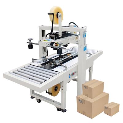 China Food FXJ-6050 Hualian Hard Tool Mobile Phone Case Packaging Box Milk Automatic Carton Sealer Machine for sale