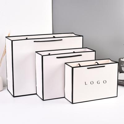 China Wholesale Luxury High End Printed White Shopping Paper Bags Recyclable With Your Own Logo for sale