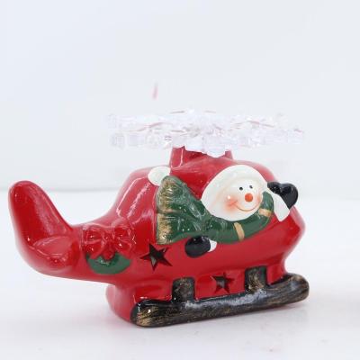 China Classic Santa Sitting Red Plane Decoration Ceramic Figurine Christmas Holiday Ornament Gift Collection for sale