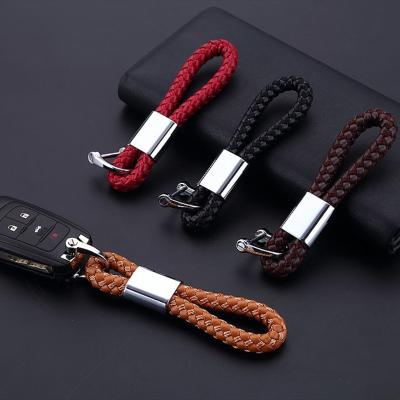 China Creative Metal Leather Rope Men's Handmade Woven Anti-fall Car Key Chain for sale