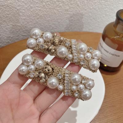 China Fashion Hair Accessories Women Heavy Industry Women's Crystal Elegant Retro Fashion Bear Pearl Clip Hair Edge Clip Broken Hair Pins for sale