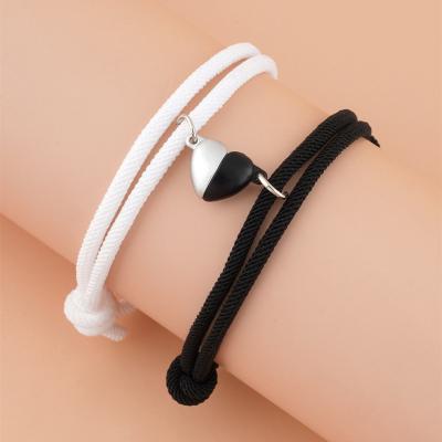 China Trendy Milan Rope Woven Lovers Adjustable Heart Shaped Black and White Heart Shaped Magnetic Buckle Bracelet for sale