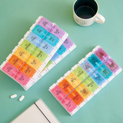 China Factory Direct Supply Eco-Friendly Weekly Pill Organizer Portable Medicine Box 14-Grid Double-Row Detachable Button Bounce Colorful Plastic Weekly Pill Box for sale