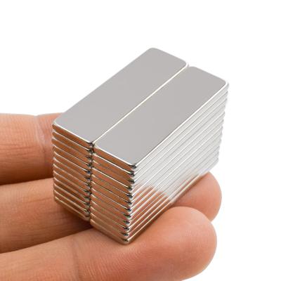 China Industrial Magnet 30*10*2MM Magnetic Cube Block Customized Grade N35 coating Nickel Neodymium Magnets for sale