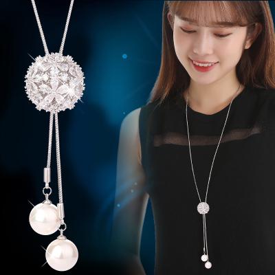 China 2022 New Luxury Hollow Pearl Ball Zircon Tassel Necklace Women's Exquisite Sweater Chain Fashion Pendant Wholesale Women's Sweater Chain for sale