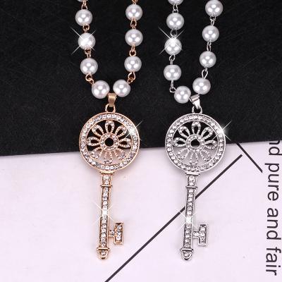 China 2022 New Fashion Charm Sweater Chain Luxury Crystal Pendant Wholesale Women's Tassel Key Pearl Jewelry Luxury Long Necklace for sale