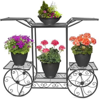 China Modern Indoor Outdoor Garden Modeling Corner Steel Flower Pot Black Metal Plant Stand With Four Rear Wheels for sale