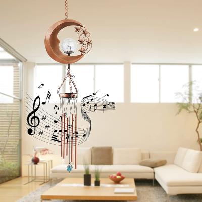 China Modern Outdoor Hanging Moon Metal Sun Waterproof Warm Led Lights Garden Yard Solar Wind Chime Light for sale