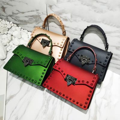 China Fashion Handbag\Newest PVC Jelly Candy Shoulder Hand Bag 2022 Famous Comfortable\Durable Fashion Brands Handbag Ladies Luxury Purse And For Women Rivet Bag for sale