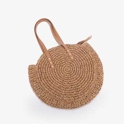 China Women's Bohemian Shoulder Straw Bags Woven Tote Bag Handmade Hollow Out Crochet Handbag Fashion Art And Fresh New Round Rattan Bag Beach for sale