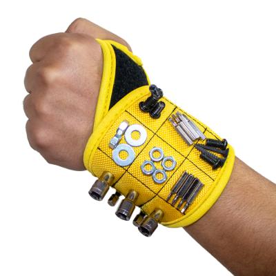 China Use powerful magnet for fixing screws, nails, magnetic drill bit (black) wrist strap for sale