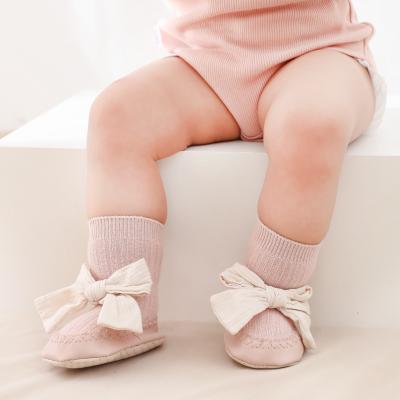 China Autumn Winter Baby Socks Lovely Antibacterial Bow PU Newborn Baby Boy Shoes Booties Anti-slip Floor Infant Socks for sale