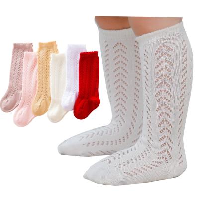 China Antibacterial Spanish Style Baby Socks Fashion Hole Toddler Solid Hollow Knee High Socks Kids Dress Socks for sale