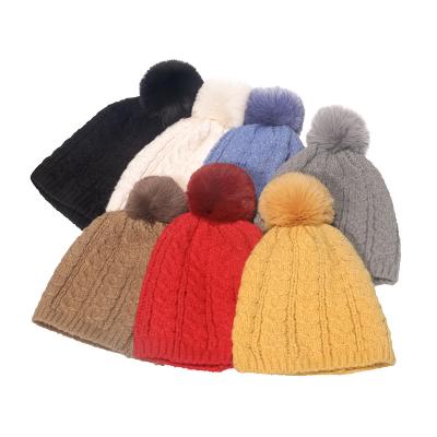 China Autumn Winter Adults COMMON Pom Pom Knitted Warm Beanie Hat Plain Women Men Earflap Hats for sale