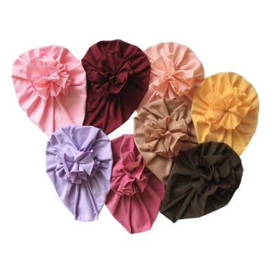 China For Party and Daily Wear Fold Soft Flower Baby Hat Cotton Princess Newborn Girl Beanies Candy Colors Baby Turban Hood for sale