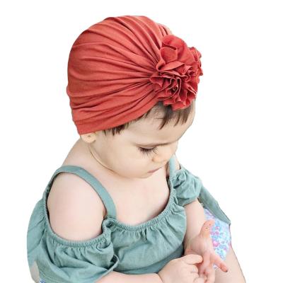 China Soft Baby Picture Cotton Hat Plain Color Newborn Flower Turban Infant Hat for sale