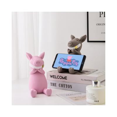 China Resin Durable Using Low Price Resin Pig Phone Holder Stand Mobile Phone Smile Holders for sale