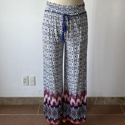 China Anti-wrinkle casual women's pants floral print trousers with tassel rope fashion placement printing trousers for sale