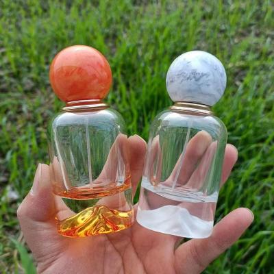 China 30ml 50ml 100ml Cosmetic Perfume Bottles Resin Cover Perfume Bottle Round Glass Perfume Bottle for sale