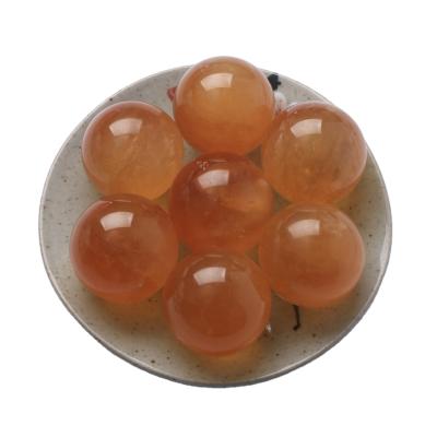 China Europe Healing Crystal Ball Orange Calcite Crafts Pineapple Honey Calcite Stone Crystal Sphere for sale