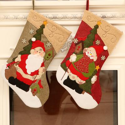 China Classic Sinyoo 3D Style Santa Snowman Reindeer Character Christmas Large Stocking Christmas Decoration for sale