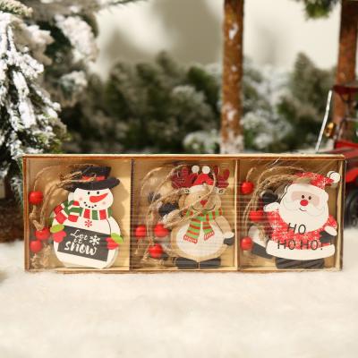 China Sinyoo Wooden Christmas Tree Printed Wooden Hanging Ornaments For Christmas Home Decoration 9PCS A Set for sale