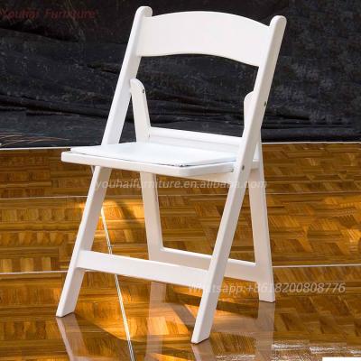 China Beautiful And Convenient Hotel Chair Grip White Plastic Folding Chair for sale