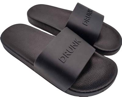 China Fashion Trend Color Men's Custom Logo 3D Rubber Embossed Slide Sandals For Women And Ladies Flip Flops Slippers for sale