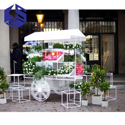 China Mordern favorable price on discounts outdoor metal flower cart wheels white decorative cart gift cart for wholesale for sale