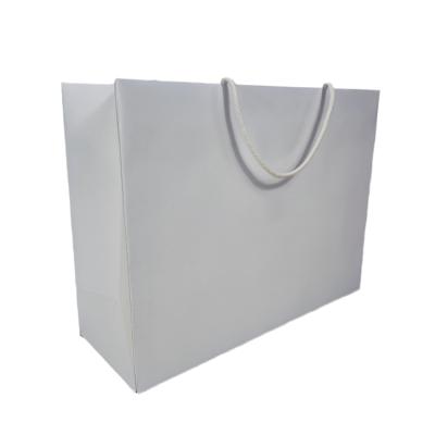 China Recycled Materials Customized Logo Design Your Own White Paper Bags Rope Handle With Ribbon Tie Bow for sale