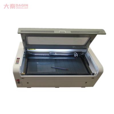 China Laser CUTTING High Productivity Daqin Laser Engraving Machine For Mobile Laptop Tempered Glass Screen Protector Nano Glass Protector for sale