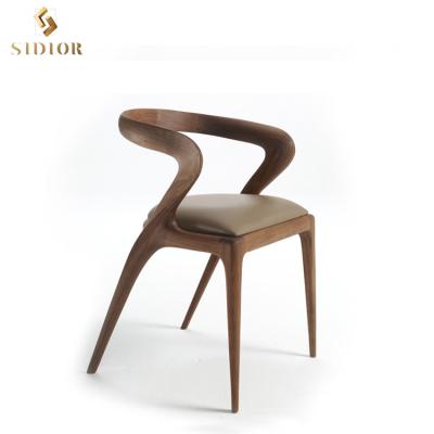 China Hot Sale Cooling Leather Upholstered Cushion Dining Chair Solid Wood Dining Chair With Curved Wooden Legs for sale