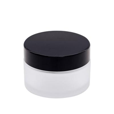 China Non Spill 15g 20g 30g Clear Glass Cosmetic Glass Jar Black Lids Frosted Cosmetic Jars Luxury for sale